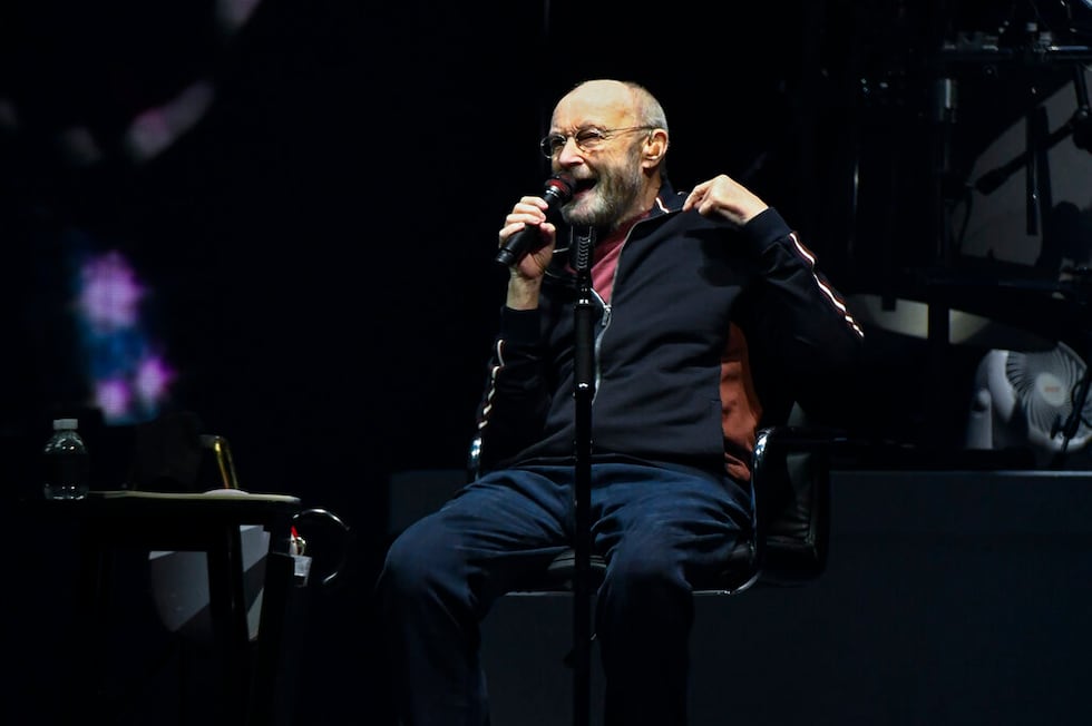 Singer Phil Collins leads Genesis as they play in their "The Last Domino?" tour at the United...