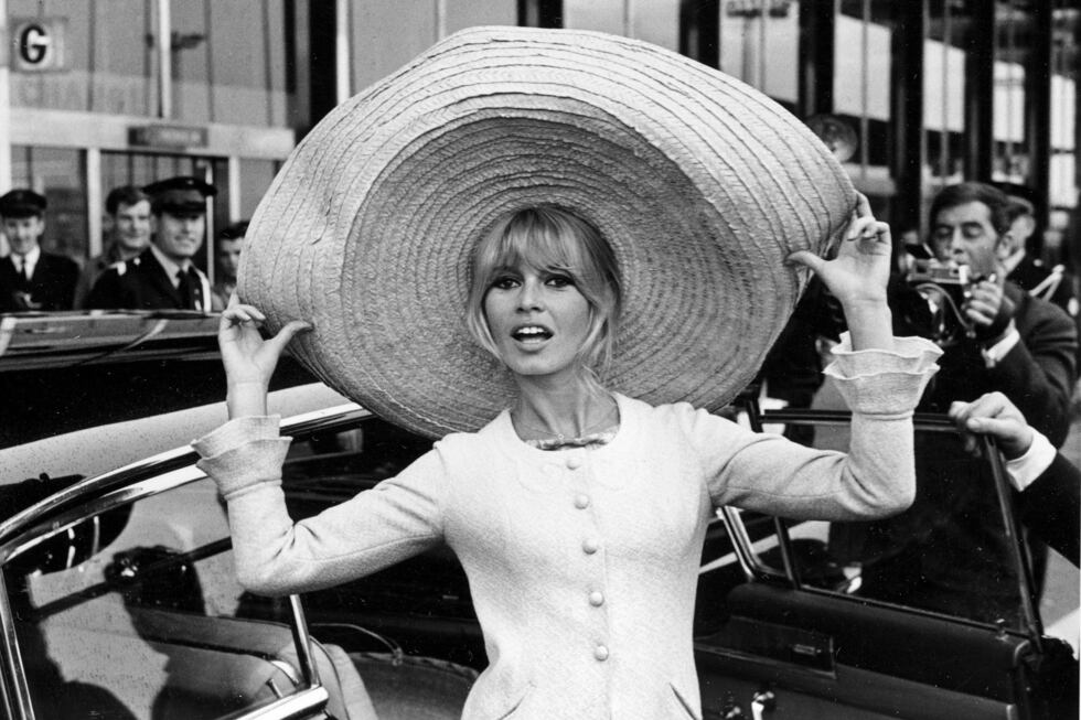 FILE - French actress Brigitte Bardot poses with a huge sombrero she brought back from Mexico,...