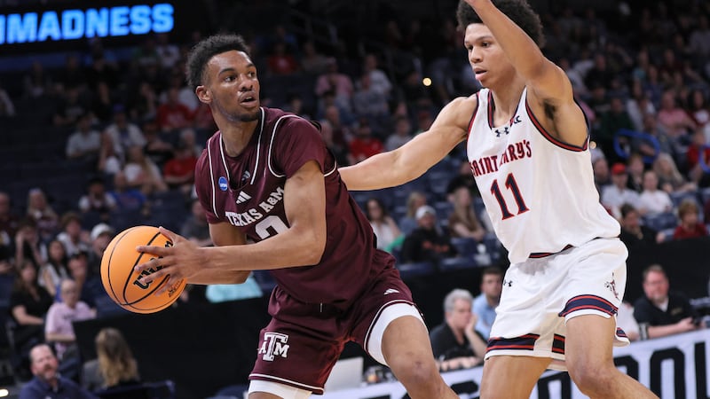 Texas A&M guard Rylan Griffen, left, looks for an outlet against Saint Mary's guard Dillan...
