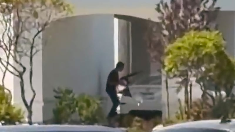 This still image captured from video by a witness shows the scene of a shooting that started...