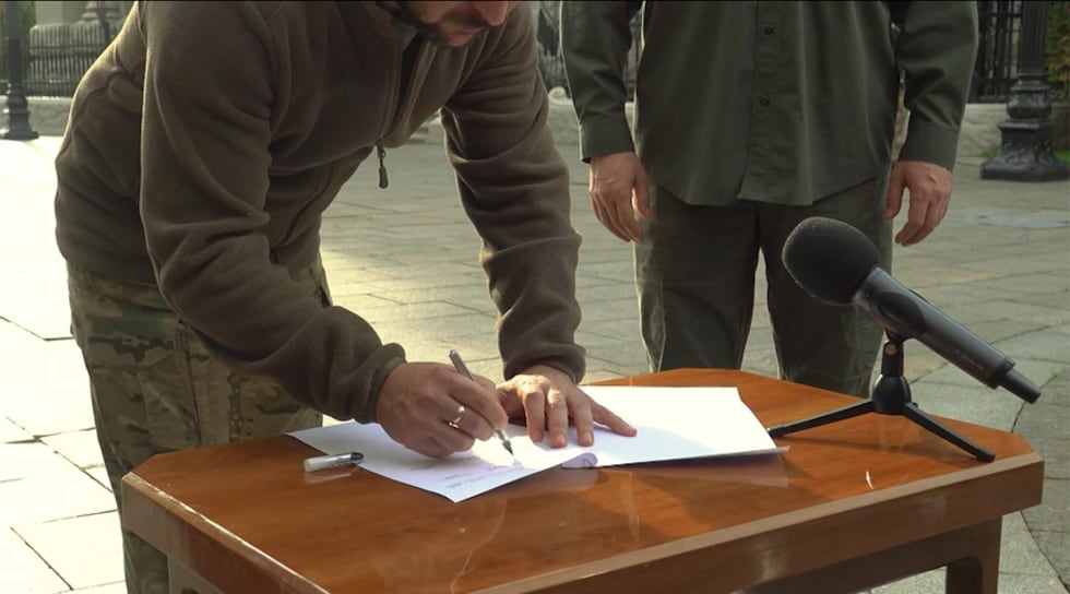 Ukrainian President Volodymyr Zelenskyy signed what he said was an accelerated application for...