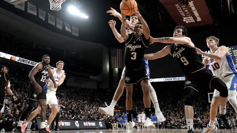 Texas A&M guard Rylan Griffen (3) grabs a rebound against Florida during the first half of an...